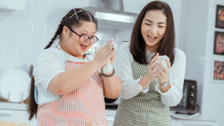 Two people cooking