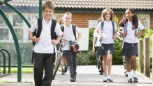 Primary school students walking side by side