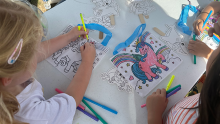 Children colouring on paper