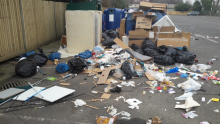 Rubbish on floor around recycling bank