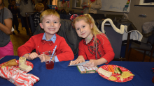 A child and child sitting at a table